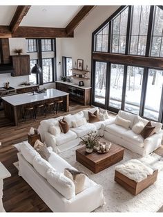 a living room filled with white furniture and lots of windows