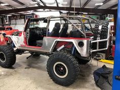 an off road vehicle parked in a garage