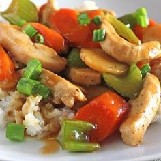 chicken and vegetable stir fry with rice on a plate