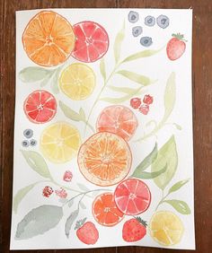 an art project with fruit painted on paper