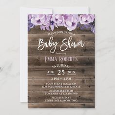 baby shower with purple flowers and wood