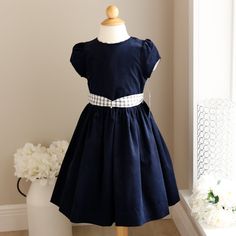 This Navy Girls Dress Is A Classic!! This Special Dress Is By Bailey Boy's, A High-End Boutique Brand. The Dress Is Done In A 100% Cotton Pin Wale Corduroy, Giving It A Soft, Velvety Texture And Appearance- So Plush!! The Simple Rounded Neckline Is Trimmed In Blue And White Fitz Windowpane Plaid Piping, Giving A Tailored Finish. The Longer Length Skirt Gathers At The Waist. A Matching Windowpane Plaid Sash Ties Into A Big Bow In The Back For The Perfect Fit. Can Wear Bow In Front To The Side Als Girls Navy Dress, Special Dress, Navy Girls, Windowpane Plaid, Special Dresses, Big Bow, Rounded Neckline, Boutique Brands, Big Bows