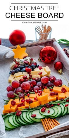 christmas tree cheese board with fruit and crackers