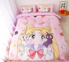 a pink bed with cartoon characters on it