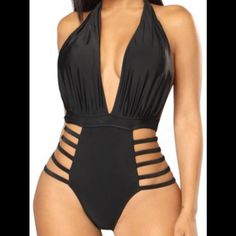 Yira Bandage Swimsuit You Can Also Wear This As A Bodysuit Brand New Size Xl With Tags Ask Questions Check Out My Other Items Open To Offers Black Stretch Strappy Bodysuit, Black Triangle Top Bodysuit For Vacation, Black Bodysuit With Lined Body For Vacation, Black Lined Bodysuit For Vacation, Black Halter Neck Bodysuit For Pool, Black Strappy Beachwear Bodysuit, Black Halter Neck Bodysuit For Beach, Black Strappy Bodysuit For Beachwear, Black Halter Neck Bodysuit For The Beach