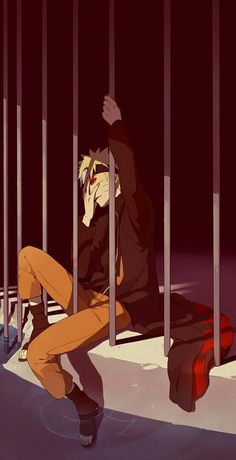 a person sitting on a bench behind bars