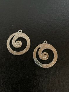 "2 silver tone flower printed spiral charms, spiral charm, silver spiral pendant, silver spiral charms, spiral pendant, charm spiral, reversible pendant, spiral Reverses to dimensional abstract design. ★ Pendant Size: 1 1/8\" L X 1\" W. ★ More pendants, charms, beads, jewelry making supplies and buttons available at https://www.etsy.com/shop/ElevenWestDesigns" Spiral Pendant, Pendant Silver, Beads Jewelry, Jewelry Making Supplies, Flower Prints, Abstract Design, Silver Tone, Charms, Jewelry Making