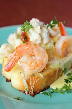 a piece of bread topped with shrimp and cheese