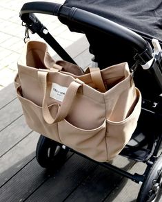 a baby stroller with a bag attached to it