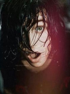 a close up of a person with wet hair