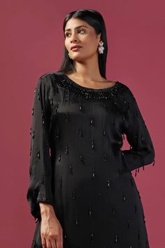 Black kurta with cutdana, tassel embellishment. Paired with palazzo. - Aza Fashions Elegant Eid Sets With Tassels, Elegant Black Kurta For Celebration, Elegant Festival Sets With Tassels, Elegant Tassel Sets For Festivals, Elegant Party Kurta With Cutdana, Elegant Festive Sets With Back Tassel Tie-up, Festive Straight Kurta Tops For Party, Elegant Straight Kurta Blouse For Party, Elegant Party Blouse With Straight Kurta Shape