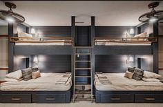 two bunk beds in a room with lights on the ceiling and carpeted flooring