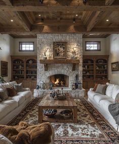 a living room filled with furniture and a fire place in the middle of a room