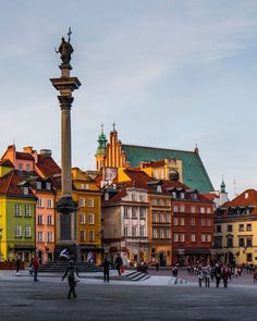 people are walking around in the city square