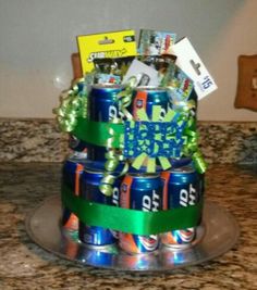 a birthday cake made out of cans and ribbons