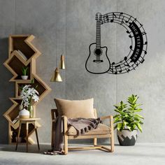 a guitar wall decal in a living room with a chair and potted plant