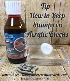 a bottle of soap next to an acrylic block on a wooden background with the words tips how to keep stamps on acrylic blocks