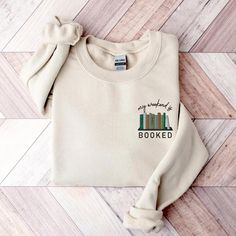 Introducing our Embroidered my weekend is booked Sweatshirt - a cozy Bookish Sweatshirt perfect for those who would rather curl up with a book. This Book Lovers Shirt, perfect for teachers and book club enthusiasts, features a meticulously embroidered book shelf. Elevate your style with this unique piece that captures the essence of a bookworm's world in a comfortable, stylish Crewneck. Browse through my other awesome items here: https://grumpygooseapparel.etsy.com ABOUT THE PRODUCT: Unisex Heav Sweater Embroidery, Sweat Shirts, Toddler Hoodie, Gildan Sweatshirts, Embroidered Sweatshirt, Color Shirt, Boys Hoodies, Women Hoodies Sweatshirts, Cat Paws