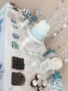 a table topped with lots of desserts and cupcakes