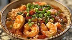 a close up of a bowl of food with shrimp