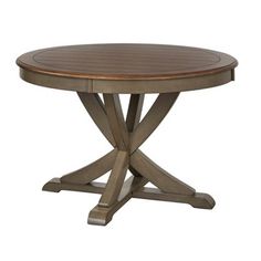 a round wooden table with two cross legs