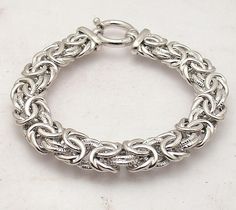 Bold Textured Handmade Byzantine Bracelet Antitarnish Real 925 Sterling Silver  Metal Product ID Condition Finish Avg. Weight Width Size Clasp Retail Price Real Sterling  Silver 925 (Stamped 925) TB10-Y68 Brand New Shiny Polished Finish, Anti-tarnish Rhodium Finish 31.40 grams 13mm ~  1/2" Size selectable Spring Ring Clasp $349.99 Fall in love with this distinguished Byzantine bracelet that can be worn as a standalone piece or layered with others. From Silver Style. Rhodium-plated real sterling Byzantine Bracelet, Fine Jewelry Bracelets, Silver Style, Bracelets And Charms, Spring Rings, Rhodium Plated, Silver 925, Silver Fashion, Fall In Love