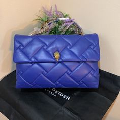 A Signature Stone-Encrusted Eagle Head Embellishes The Geo-Quilted Flap Of A Structured Handbag Crafted From Supple Leather With A Glinting Chain Strap. Lined Leather Imported Two Interior Compartments With Small Internal Lining Pocket. This Bag Can Fit Laptop Up-To 14” Color: Blue Size: Approx; 15” W X 10” H X 5.4” D High-end Blue Crossbody Shoulder Bag, Elegant Blue Double Flap Bag, Blue Luxury Clutch With Top Handle, Designer Shoulder Bag With Fold Over Clasp, Luxury Blue Top Handle Clutch, Luxury Blue Clutch With Top Handle, Formal Blue Bag With Double Flap, Formal Blue Bags With Double Flap, Formal Blue Double Flap Bag