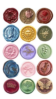 a bunch of different colored wax seals with flowers and butterflies on them, all in different colors