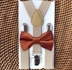 This terracotta fall floral bow tie & rust suspenders set is a great choice for burnt orange fall wedding, groomsmen suspenders, ring bearer outfit, copper bow tie, bow ties for men or any other special occasion. ❤ **Please Specify**   Bow Tie Only (w/ Clip or Neck Strap), Suspenders Only, or Bow Tie Only & Susp (Bow Tie and Suspenders) SUSPENDERS- One Pair of our Quality Suspenders BOW TIE - One Bow Tie on White Adjustable STRAP or Alligator CLIP **CLIP ON Bow Ties are Recommended/Suitable for Children Only *Sizing: Please Check Measurements Before Ordering *Note: If your gentleman wears larger clothing for his age, we recommend going by the clothing size to be safe. Any other questions on this, please just ask!  Small: 6 months- 6 years Medium: 7 years- 12 years Adult: 13 years- Up To 6f Elegant Brown Belts And Suspenders For Wedding, Elegant Brown Belts And Suspenders For Party, Men Fall Wedding, Terracotta Bow Tie, Bowtie Groomsmen, Groomsmen Suspenders, Orange Terracotta, Bow Ties For Men, Gentlemen Wear