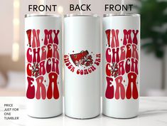 two white tumblers with red lettering on them