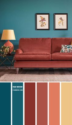 a living room with red couches and blue walls