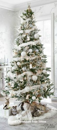 a white christmas tree in a living room