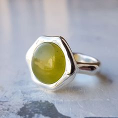 weight : 11 g. Soft cabochon. Big Sterling Silver Ring.  yellow Jade  Round Gemstone Everyday wear Ring ,  Cool modest Ring Minimalist Asymmetrical Ring ► Your Ring will come in a beautiful Ring Case, ideal for gifts or just storing your jewelry safely.       It will be posted in an extremely secure package to make sure its safe arrival at your door.  Other interesting design works in my store  :)   www.etsy.com/shop/sourenjewelry   Thank you for visiting and hope you will enjoy to shop in our store! Asymmetrical Ring, Cool Ring, Ring Case, Yellow Jade, Interesting Design, Nephrite Jade, Authentic Jewelry, Jade Ring, Ring Minimalist