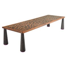 a wooden bench with metal legs and an animal print design on the top, against a white background