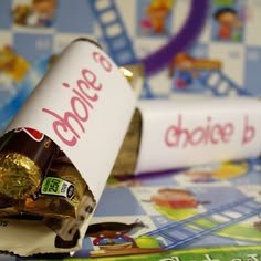 a candy bar wrapped in foil sitting on top of a table