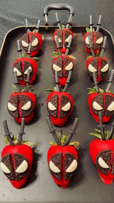 chocolate covered strawberries are arranged in the shape of heart - shaped hearts and swords