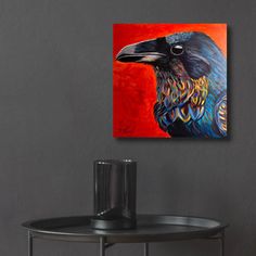 a painting of a black bird sitting on top of a table