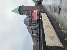 an upside down view of a building with a sign on it