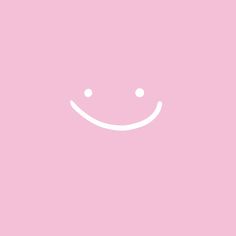 a pink background with a smiley face drawn on the front and bottom half of it