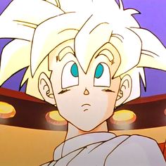 the young gohan is looking at something in front of his face with blue eyes