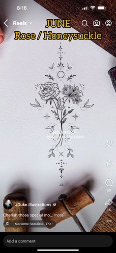 the screen is showing an image of a flower on paper with writing and ink pen next to it