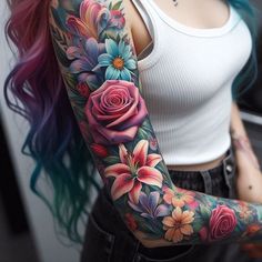 a woman with colorful hair and tattoos on her arm