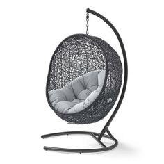 a black hanging chair with grey cushions