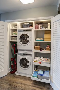 a washer and dryer are in the closet