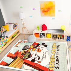 a child's bedroom with mickey mouse rug and toys