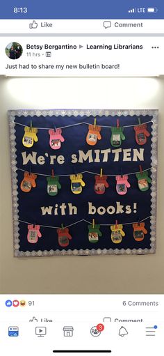 a bulletin board with shoes on it and the words we're smitten with books