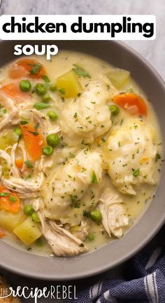 a bowl filled with chicken dumpling soup on top of a table