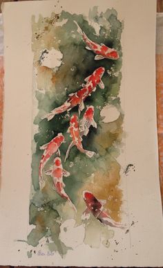 watercolor painting of three koi fish in a pond with green and yellow colors