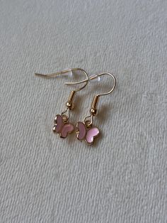 The tiniest dangle earring we have! Cute for a day of things to do or a simple touch to a night out, these earrings fit any occasion! Trendy Butterfly Jewelry For Gift, Sterling Silver Drop Earrings With Butterfly Charm, Sterling Silver Jewelry With Butterfly Charm Drop Earrings, Purple Butterfly Charm Earrings For Gift, Cute Silver Jewelry With Butterfly Charm, Dainty Pink Dangle Earrings, Pink Butterfly Charm Dangle Jewelry, Butterfly Charm Drop Earrings As Gift, Butterfly Charm Drop Earrings For Gift