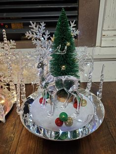 a small christmas tree sitting on top of a plate